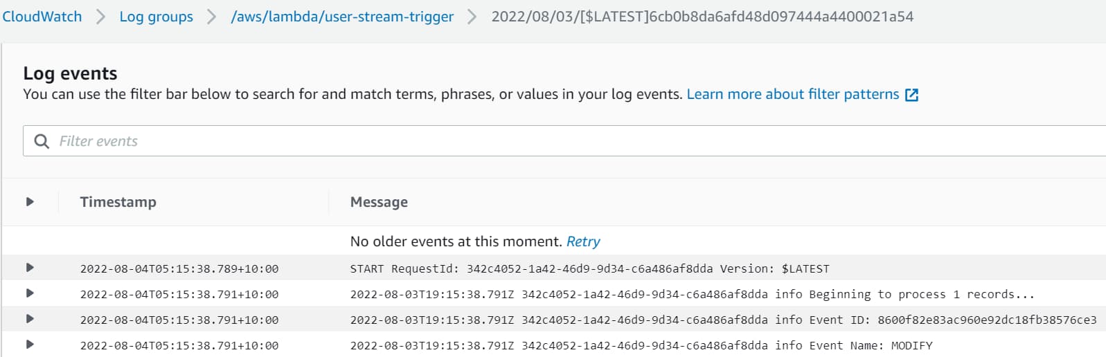 Logs in Amazon CloudWatch after updating an item in the DynamoDB table. It triggers the .NET Lambda function, which writes the details to the log.