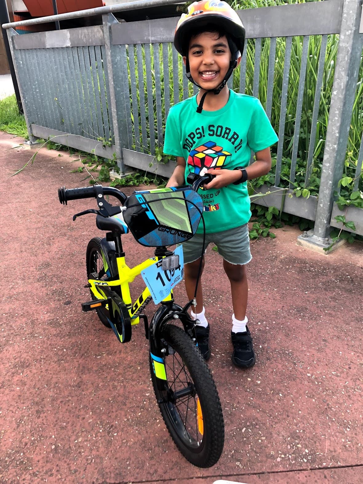 Gautham with his cycle, happy that he can ride on his own
